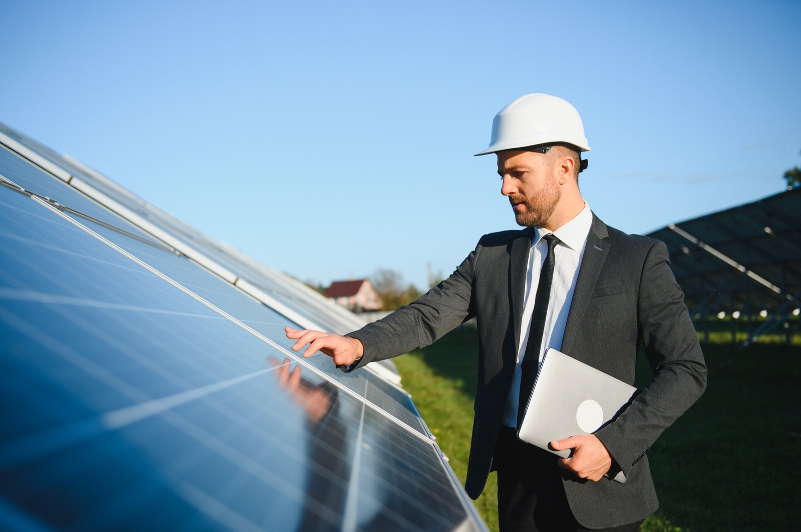 solar-power-plant-man-standing-near-solar-panels-renewable-energy.jpg